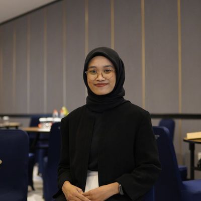 Portrait of professional female instructor Olga Zarichna smiling.